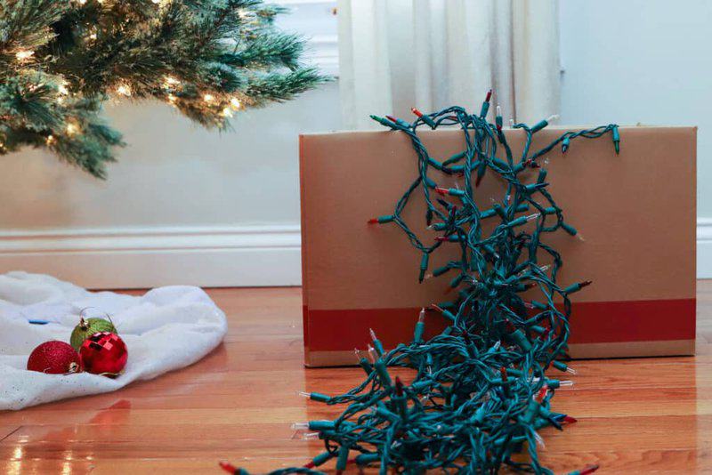 A String Of Christmas Lights In A Box Of Christmas Decorations