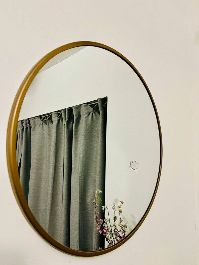 2. Round Brass-Framed Mirror