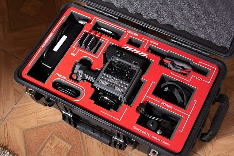 Neatly organized toolbox filled with backup items and extra cables